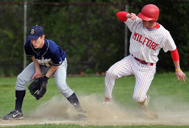 Milford's Sam Perkins gets to third safely as Shrewsbury's Dan O'Keefe handles the throw 5/13/09 in Milford.