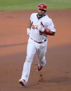 St. Louis Cardinals' Albert Pujols runs the bases after hitting his first inning solo home run against the Chicago Cubs on Thursday, May 21, 2009, in St. Louis.