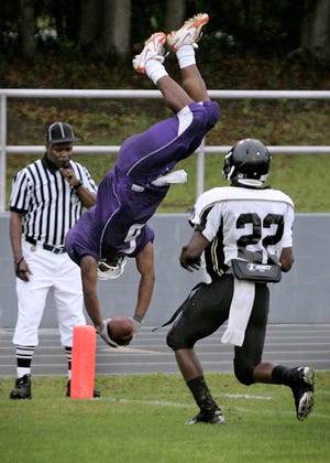 Gainesville High School's Walter Holsey dives for a touchdown against Buchholz before getting charged with an unsportsmanlike conduct penalty during the Spring Jamboree at Raider Field in Alachua.
