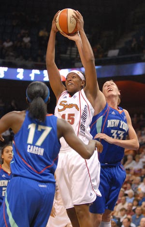 MOHEGAN 5/22/2009
Connecticut's Asjha Jones, center, keeps the ball away from New York's Catherine Kraayeveld, right, and Essence Carson, left, before shooting for a basket during the Sun's first pre-season game at the Mohegan Sun Arena Friday, May 22, 2009.
Tali Greener/Norwich Bulletin