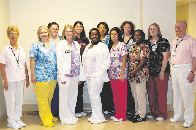 Newly graduated nurses who will be working at Winter Haven Hospital are, row one, from left, Auxiliary Treasurer Marion Green, Angel Esabrook, Rhonda Hawley, Josephine Strollo, Rosa Martinez, Noy-Starra Fountain, Kristen Randall and Joe Matthews; row two, from left, are Cassandra C. Briggs, Nicole Eup, Shanna Teague and DeeDee Watson.
