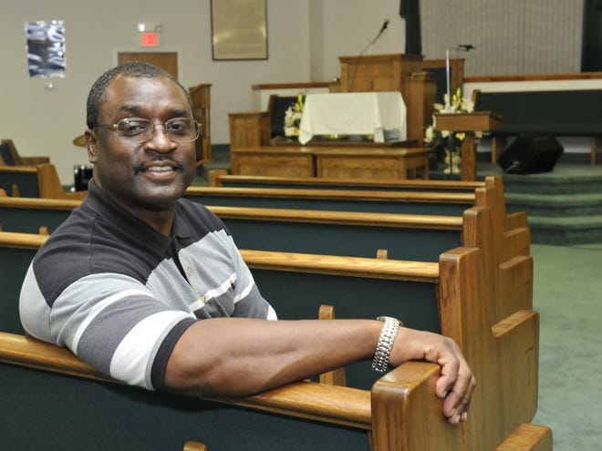 Pastor Edward Bland of Friendship Missionary Baptist Church of Dundee sits in a pew in his church. He began his career as a businessman but said he felt God's call for him to be a pastor. Wednesday, May 13, 2009.