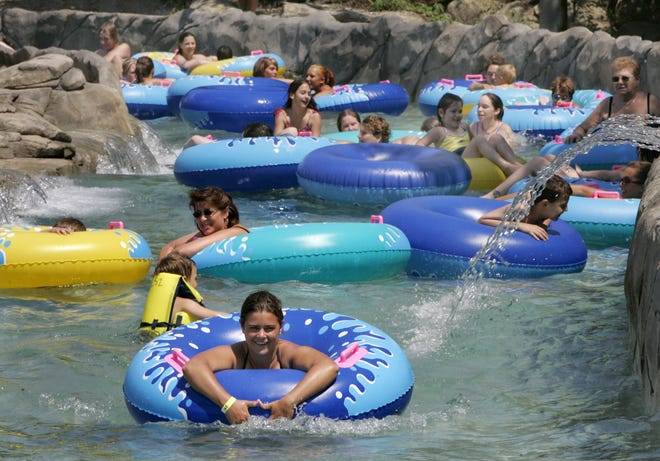 Visitors enjoy the Lazy River at Wildwater Kingdom near Aurora. It opens today and Monday.