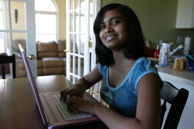 Aishwarya Pastapur practices her spelling with a computer program on her laptop.
T.J. Salsman/The State Journal-Register