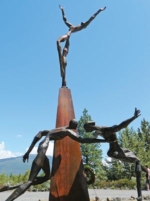 The ‘Why’ sculpture, above, depicting a soldier coming to the aid of a falling comrade is one of 10 artworks created by US?Marine Vietnam veteran Dennis Smith at the Living Memorial Sculpture Garden.