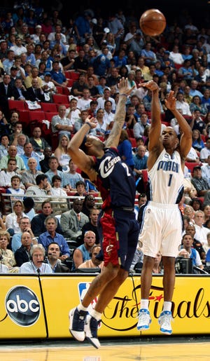 Orlando Magic guard Rafer Alston shoots a 3-pointer over Cleveland guard Mo Williams in the third quarter of Game 4. Alston scored a playoff career-high 26 points Tuesday night in Orlando’s 116-114 overtime win.