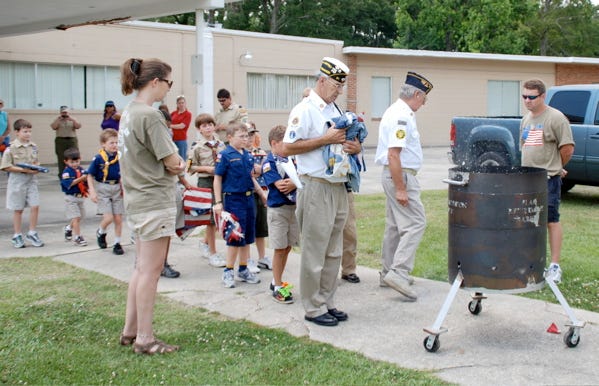 On Armed Forces Day May 16, Scout Pack 399 sponsored by American Legion Hall 81, paid its respects to fallen soldiers. After going around to local cemeteries, the troop arrived back at the Legion Hall in Gonzales and participated in a Flag Retirement Ceremony. Each scout brought a flag, after which the flag was placed and burned.