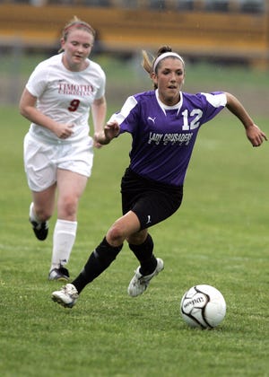 Lutheran High School's Hannah Williams (front) runs ahead of Timothy Christian's Mary Meigs in the first half of their sectional Tuesday, May 26, 2009, at Rockford Christian in Rockford.