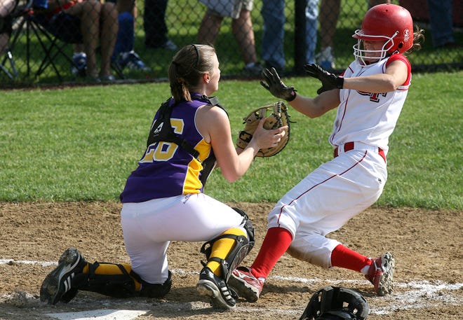 Glenwood’s Sami Estill is tagged out at home in the third inning by Taylorville catcher Kate Althoff after a throw from left fielder Brittany Grubaugh.