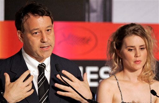 American director Sam Raimi, left, and American actress Alison Lohman attend a press conference for the film 'Drag Me To Hell' during the 62nd International film festival in Cannes, southern France, Thursday, May 21, 2009.