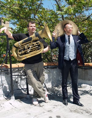 About 15 years ago, Wolff (left) saw a used sousaphone in a store window. "That sort of changed everything for me," he says. He's pictured with drummer Steve Garofano.