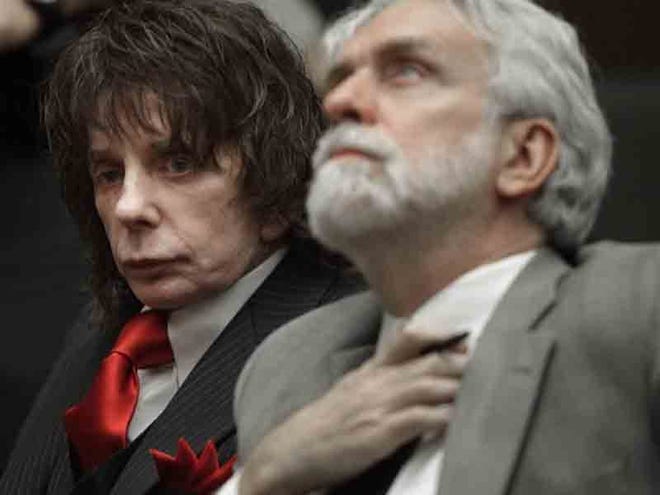 MUSIC PRODUCER PHIL SPECTOR, left, and his lawyer Dennis Riordan appear in a courtroom for Spector's sentencing in Los Angeles on Friday.