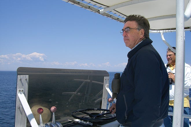 Capt. Bob Avila at the controls aboard his whale watch boat in Cape Cod Bay.