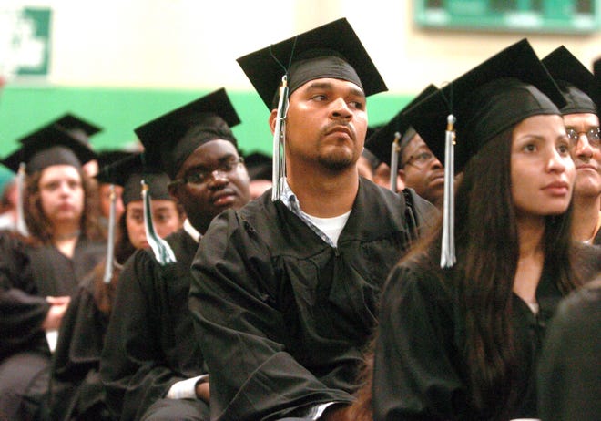 Hector Maldorado, 32, Easton, listens to speakers at Massasoit Community College's 42nd commencement exercises, held May 29.