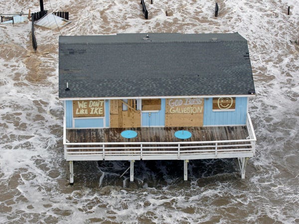 In this file photo taken Sept. 12, 2008, a boarded up home sits along the beach as Hurricane Ike approaches Galveston, Texas. As the 2009 hurricane season arrives Monday, June 1, 2009, many homeowners are finding insurance is either more expensive, or harder to get. (AP Photo/David J. Phillip, File)