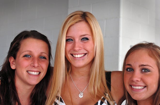 Seniors Cynthai Emery, left, Heather Thurston, and Brittany Brown at the Pembroke High School graduation.