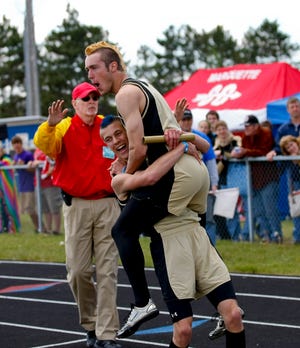 Anthony Lester, left, and Evan Everson, right, celebrate after breaking a U.P. record in the 400 relay Saturday at U.P. Finals. Rob Robinson, Caleb Litzner, Lester and Everson also tied the U.P. record in the 800 relay.