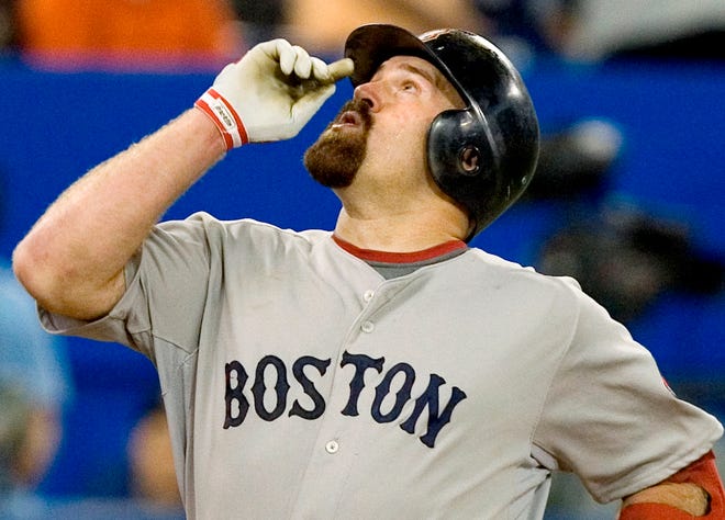 Kevin Youkilis reacts after hitting his second home run of the game during the eighth inning of the Red Sox' 8-2 victory on Sunday in Toronto.