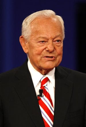 In this Oct. 15, 2008 file photo, debate moderator Bob Schieffer talks with the audience before the start of the presidential debate at Hofstra University in Hempstead, N.Y.