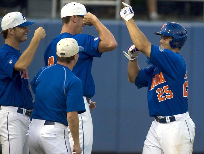 Florida's Preston Tucker (25) celebrates after hitting a home run against Miami in the fifth inning during the 2009 NCAA Gainesville Regional Baseball Championship in Gainesville, on Sunday.