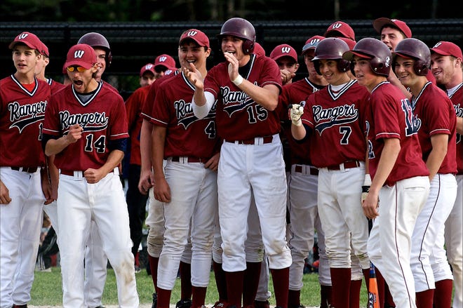 The Westborough baseball team waits at home plate for Matt Daniele after he hit one of his two home runs in the Rangers' 18-4 win over Algonquin.