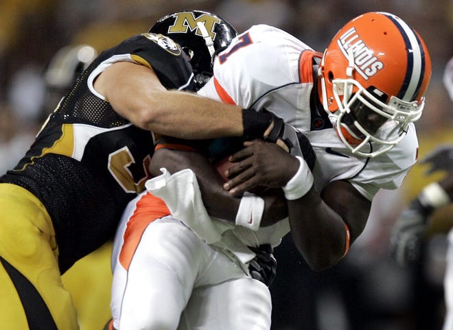 Illinois quarterback Juice Williams, right, is sacked for a 7-yard loss by Missouri lineman Stryker Sulak during the third quarter of a football game Saturday, Aug. 30, 2008, in St. Louis. (AP Photo/Jeff Roberson)
