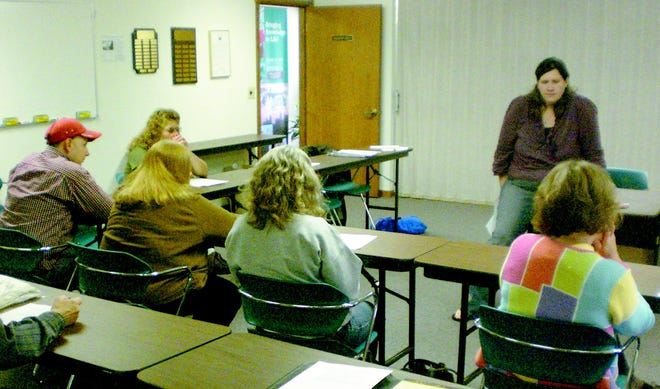 Sarah Faronczak leads a discussion Tuesday night, June 2, 2009, about the creation of a farmers market in Hillsdale.