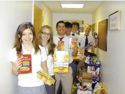 Photo by Lee Williams/New Jersey Herald Students at Pope John XXIII Regional High School were among the top five schools to collect food for the Foodstock School Challenge. This year they collected 1,923 items, or 2.02 items per student. The top school was Immaculate Conception School in Franklin. From front, Pope John students Rachael Luff, Jaime Kaiser, Pat Gonabe, Philip Reid, Joe Hark and Mike Williams. Their campaign was “Fill the Bucket.” They placed a bucket in one department each week. Once the classrooms in that department filled the bucket, it was moved to a new classroom or department.