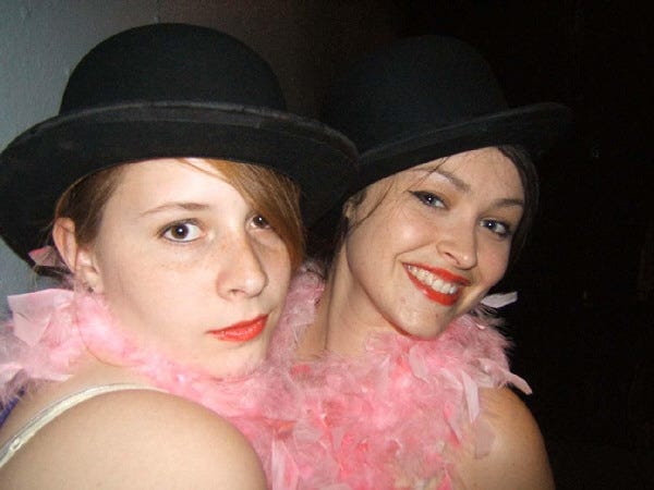 Kelly Mosher, left, and Caitlin Mills play Roxie Hart and Velma Kelly, two murderesses competing for the limelight, in the Academy of Performing Arts production of “Chicago.”