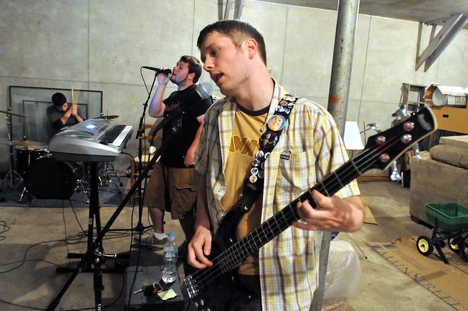 Mark Lawton, foreground, Ryan McMullen and Joe Benatti on drums rehearse in Ashland, Tuesday, June 2, 2009. Their band, Ashlands Attic, takes the stage at the Lucky Dog in Worcester tonight, June 4.