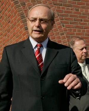 Former Massachusetts House Speaker Salvatore DiMasi speaks briefly to reporters as he leaves federal court in Boston on Tuesday.