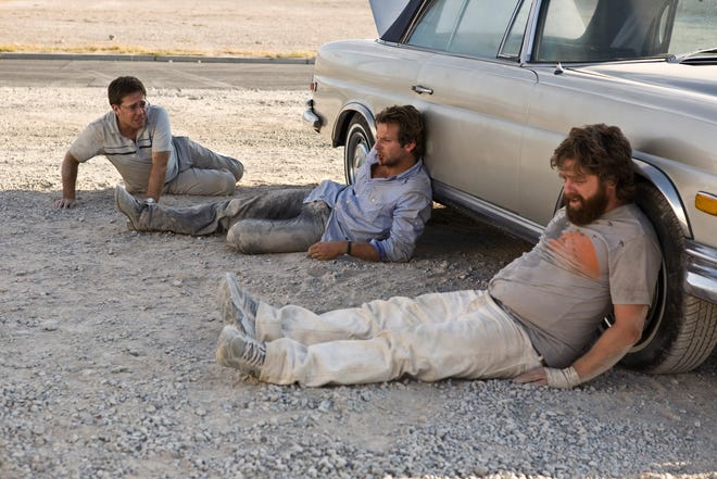 Zach Galifianakis, right, Bradley Cooper, center, and Ed Helms are shown in a scene from "The Hangover."