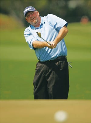 Mark Calcavecchia chips to the third green during the final round of the Honda Classic golf tournament in Palm Beach Gardens in March.