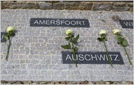 Roses were left by Mr. Obama, Chancellor Angela Merkel and the Holocaust survivors Bertrand Hertz and Elie Wiesel.