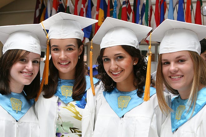 Graduating seniors gathered in the cafeteria at Ashland High School before graduation exercises on Sunday afternoon. From left are: Amy Cuneo, Madeleine Bartzak, Ali Koulopoulos, and Tasha Nicholson.