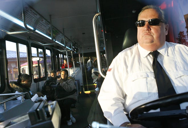 BAT driver Owen Donovan of Brockton waits in his bus at the BAT central terminal as riders board his bus headed for Ashmont. Due to high gas prices, BAT has seen a 16 percent increase in ridership to Boston.