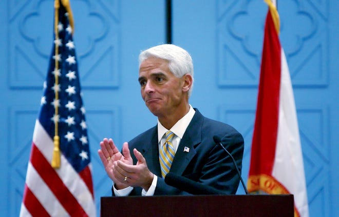 Gov. Charlie Crist applauds students from the Florida Youth Council leadership group, after delivering remarks Friday at The Family Cafe annual conference at Walt Disney World.