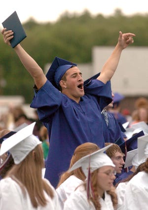 Josh Hines of Norton cheers on his classmates as they receive their diplomas during Wednesday's commencement exercises at Southeastern Regional Vocational Technical High School in Easton.