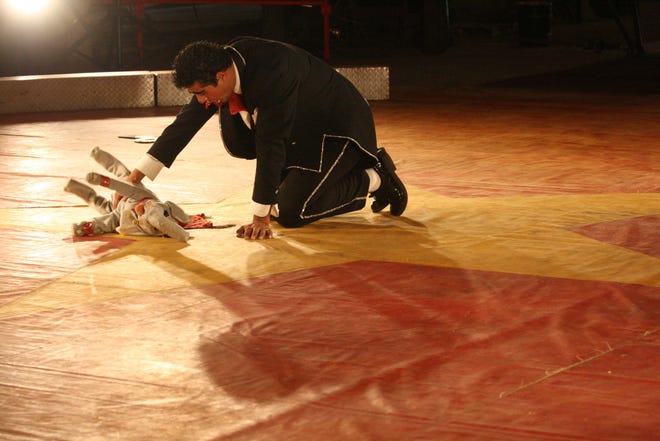 One of the performers at Circus Pages did an act with his baby elephant, which was later discovered to be a dog in a costume, to the amusement of many during the event at the Hillsdale County Fairgrounds on Tuesday, June 9, 2009.