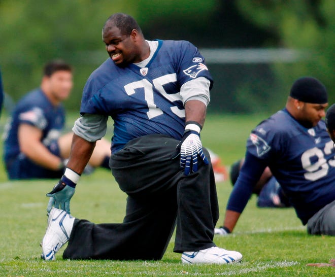 Vince Wilfork (75) stretches on the field during the first day of mandatory minicamp in Foxboro.