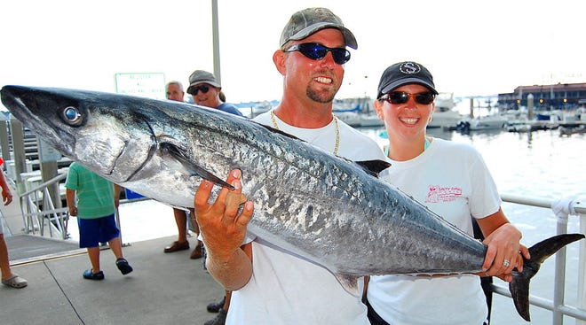 JIM SUTTON/The Florida Times-UnionMike and Melissa Senior bring a 38.50-pound kingfish to the scales Saturday. It gave Melissa first place in the Lady Angler category, fourth overall.