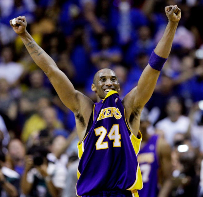 The Lakers' Kobe Bryant celebrates after his team beat the Magic, 99-86, in Game 5 to win the NBA championship on Sunday night in Orlando.