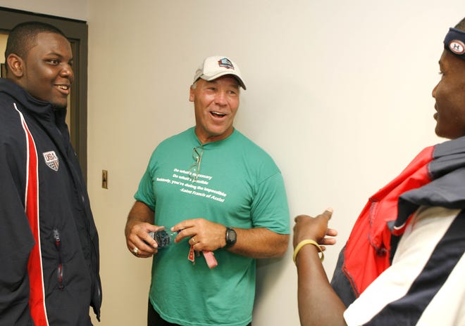 Pro Football Hall of Famer Joe DeLamielleure speaks Tuesday with USA Football junior national players Micajah Reynolds (left) and Chris Norman. Like DeLamielleure, a Michigan State alum, Reynolds and Norman grew up in Michigan and will play for the Spartans.