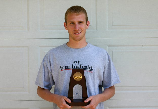 Logan Hohl holds the trophy he received after claiming his first individual All-American title.