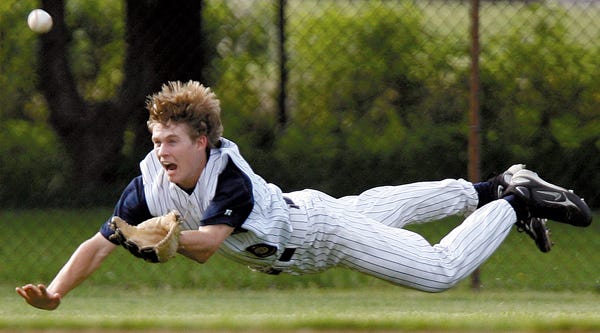 Galesburg Legion Post 285 left fielder Dalton Davis makes a diving effort but comes up short during the first game of Wednesday's doubleheader with Brimfield at Sundberg Field.