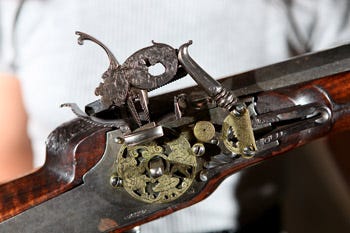 An ornate English fowling gun is part of the “Aesthetics of Power” exhibit at the Appleton Museum in Ocala.