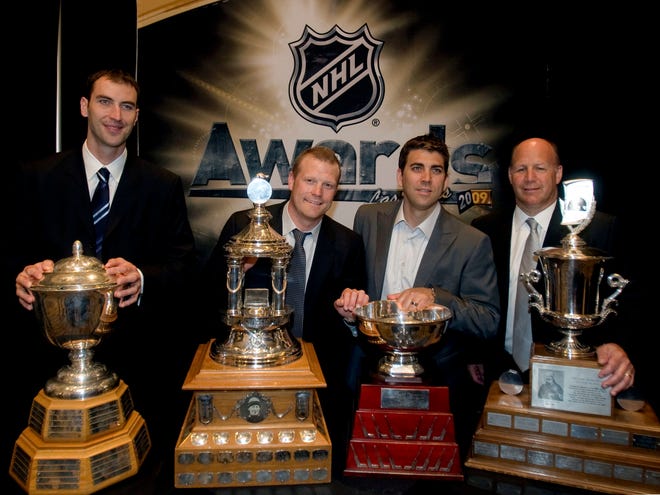 embers of the Boston Bruins show off the hardware they picked up at the NHL awards ceremony. From left are defenseman Zdeno Chara, winner of the Norris Trophy; goalie Tim Thomas, winner of the Vezina and Jennings (lowest goals-against average) trophies; goalie Manny Fernandez, winner of the Jennings Trophy; and coach Claude Julien, winner of the Jack Adams Award.