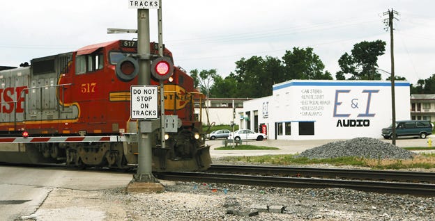 A train crosses West Main Street in Galesburg Friday afternoon. The proposed overpass at the location would have an impact on the properties surrounding the construction of such a project.