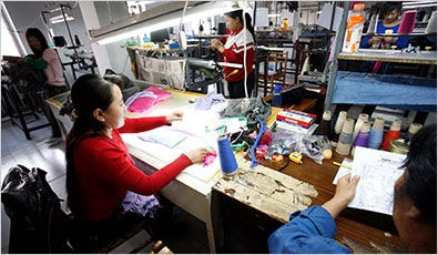 Workers at the Inner Mongolia Harmony Industry and Trade Company Ltd. factory in Hohot.