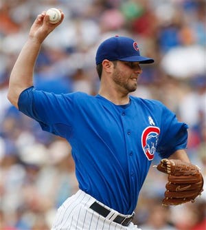Chicago Cubs starter Randy Wells delivers a pitch against the Cleveland Indians during the third inning of a baseball game in Chicago, Sunday, June 21, 2009.